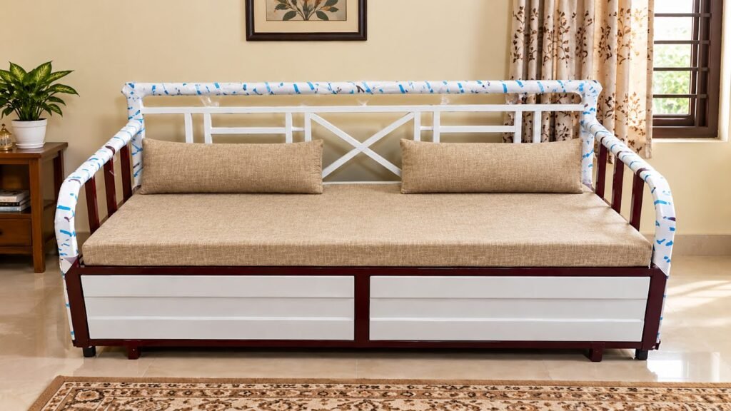 Beige metal sofa cum bed by Tuba Furniture, Pune