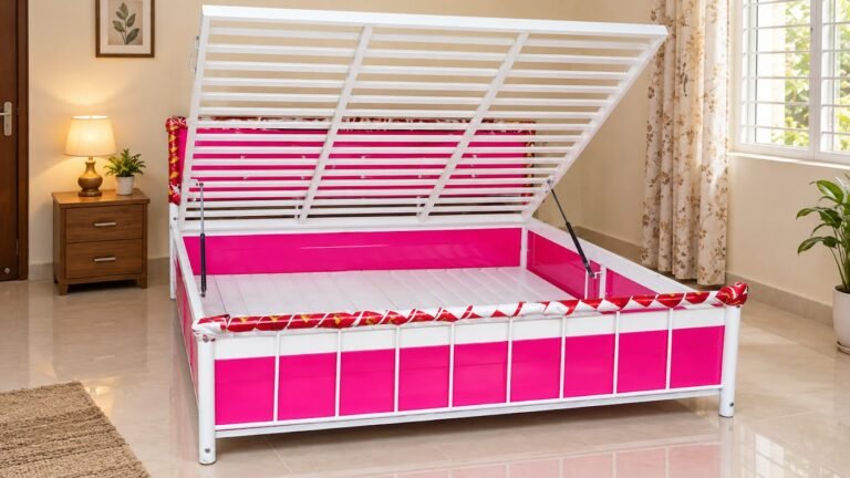 Pink metal bed with lift-up storage by Tuba Furniture, Pune